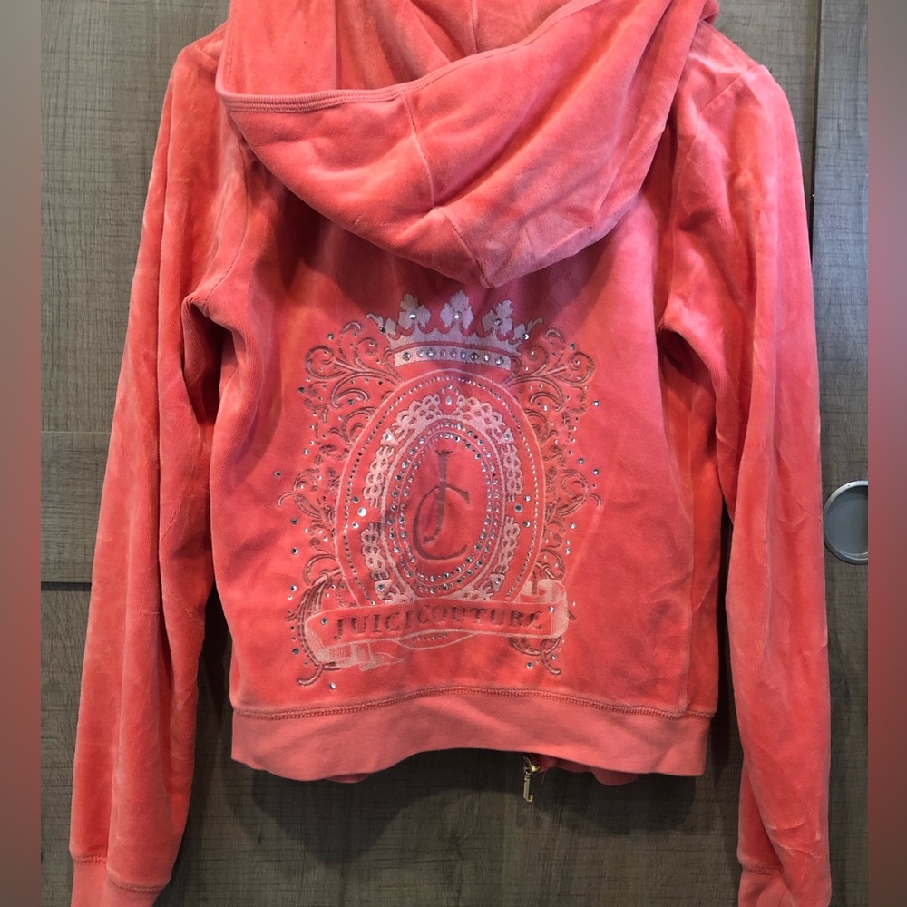 Y2K Juicy Couture peach velour tracksuit zip-up hooded jacket.